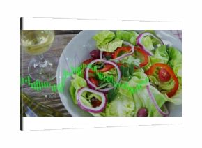 Featuring white bowl of fresh salad on rustic wooden table, with wine glass and oil cruet