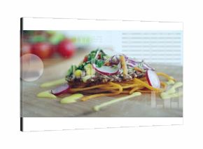 Displaying multigrain crispbread topped with veggies and sauce on wooden board with chart overlays
