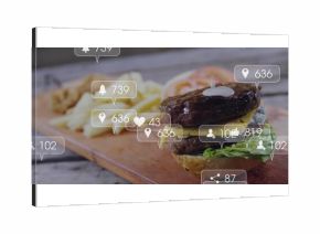 Showing double cheeseburger with lettuce sauce on board with fries plus social overlays, copy space