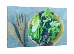 Showing wooden salad bowl holding lettuce on grey countertop, with wooden servers and tech overlays