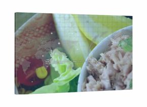 White bowl with flaked tuna, lettuce sitting in layout, with dotted world map, code-text overlay