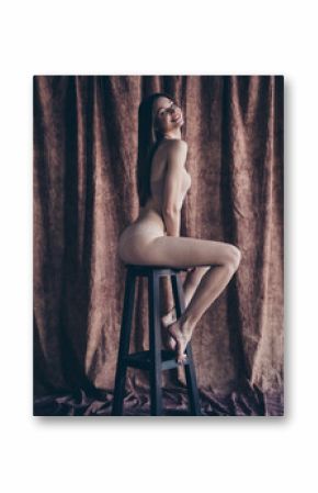 No filter photo of happy stunning lady sitting stool posing for photo shooting isolated studio background