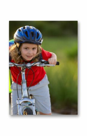 Little kid boy ride a bike in the park. Kid cycling on bicycle. Happy smiling child in helmet riding a bike. Boy start to ride a bicycle. Sporty kid bike riding on bikeway. Kids bike.