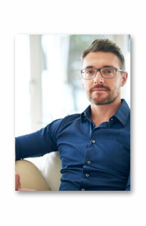 Businessman, glasses and portrait on sofa in airport for work, relax and out of town startup project. Male person, corporate and unwind on couch in waiting room for international, travel and company