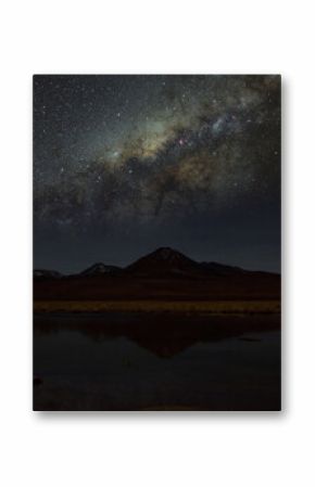 Nocne gwiazdziste niebo oraz nasza galaktyka Droga Mleczna z odbiciem w lagunie w Andach chilijskich - Night starry sky and our galaxy Milky Way with reflection in the lagoon in the Chilean Andes