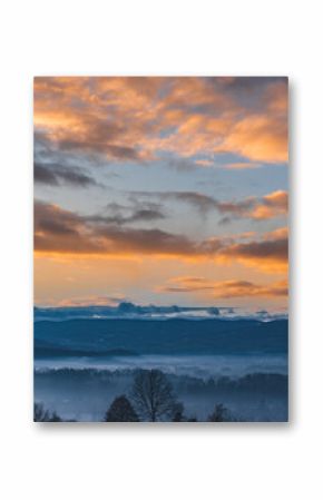 misty sunrise with orange clouds