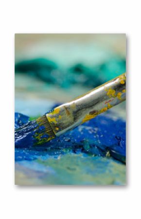 Paint brush and blue oil paint