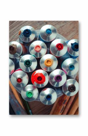 Vintage stylized photo of oil multicolor paint tubes closeup and