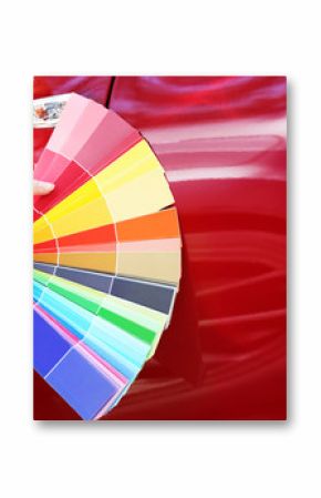 Female hands with paint samples choosing color for painting car, closeup