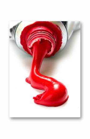 red paint color flowing out of a tube, closeup isolated on white