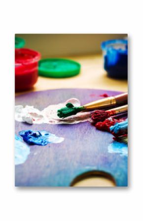 artist's workshop. Easel with brushes and tubes of paint