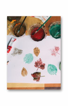 Painted leaves in paper with acrilic paint