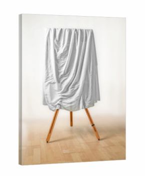covered painting on an easel, white cloth over the picture, wooden floor and light background, art concept for an exhibition opening day or a presentation ceremony, copy space
