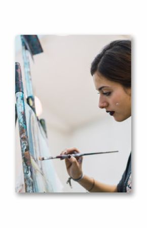 Creative woman painting in studio