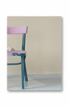  woman's hand painting chair in pink at home