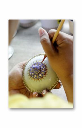 artist painting benjarong ceramic ware