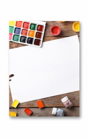 Flat lay composition with empty paper and painting supplies for child on table. Space for text