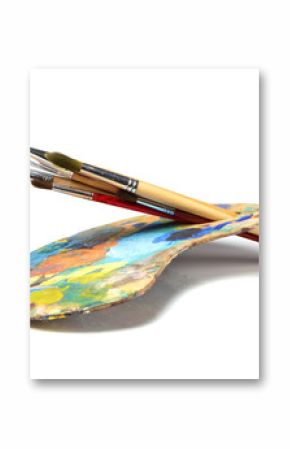 Art palette with paint and a brush on white background