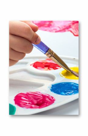 Child painting with brush