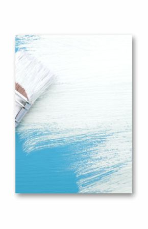 Paintbrush with white paint painting over blue