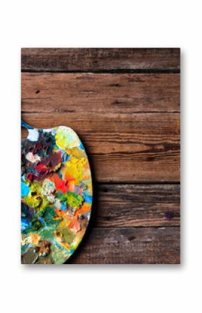 Painting palettes on wooden background