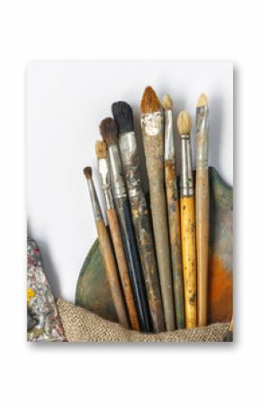 Brushes, palette and tubes with paint