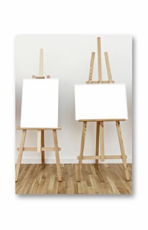 Four art studio easels with blank white frames to add paintings or pictures 