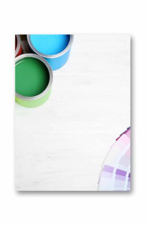 Flat lay composition with paint cans and color palette on wooden background. Space for text