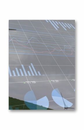 Image of financial data processing over wind turbine in countryside