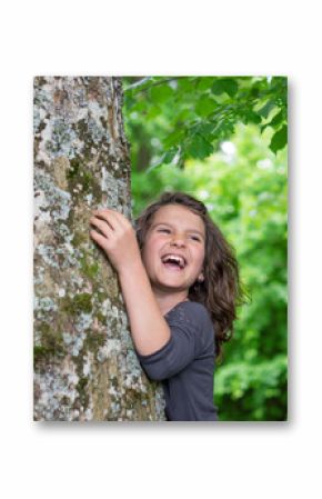Happy laughing Girl holding big tree