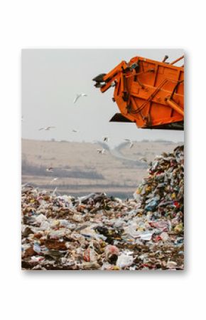 Garbage truck dumping the garbage on a landfill 