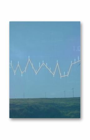 Displaying wind turbines rising from green grassland under bright sun, with financial chart overlay