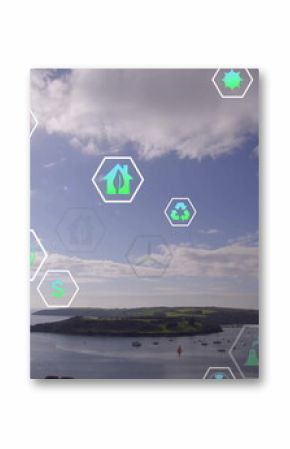 Displaying bay with boats reflecting sunlight on water at peninsula, digital sustainability icons