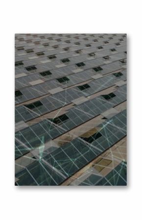 Spanning photovoltaic panels stretching across solar farm grid, with metal rails and supports