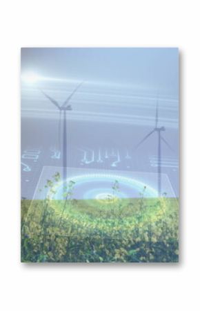 Spinning wind turbines powering grassland with yellow blooms, sun glare, digital circuit overlay
