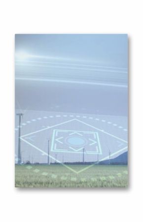 Featuring row of wind turbines with transparent digital HUD overlay in grassy field, mountain ridge