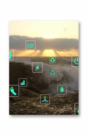 Crashing ocean wave smashing over jagged rocks on rocky coast at sunset, with eco icons overlay