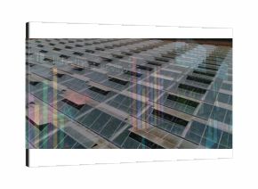 Tilted photovoltaic panels reflecting surroundings on outdoor solar array, with bar-chart overlays