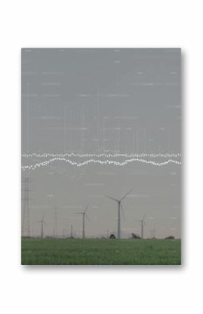 Standing white wind turbines lining grass field, with pylons, power lines, digital waveform overlay