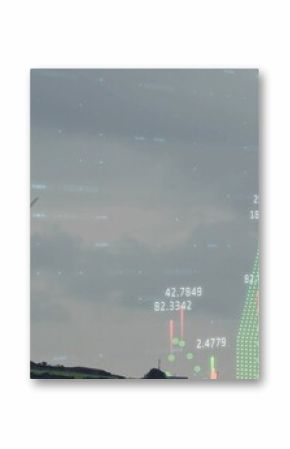 Standing wind turbine on rural hillside, with candlestick chart numeric points overlay, copy space