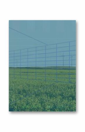 Displaying blue grid overlaying yellow field at farmland, with wind turbines and data graphs