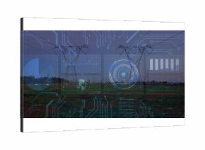Dominating steel lattice towers carrying power lines across grassy field at dusk, with HUD overlays