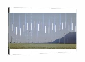 Spinning white wind turbines rotating across green field at mountain slope, with data bars faint 5°