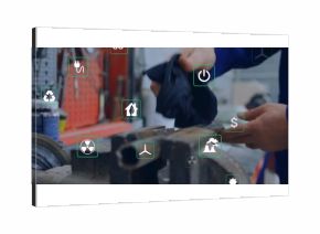 Technician wearing coveralls wiping workpiece in workshop, vise, tools and energy icons, copy space
