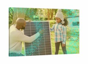 Pointing parent-child holding solar panel in yard, with hat, plaid and sweater-jeans turquoise dots