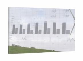 Overlaying transparent bar chart across cloudy sky above rural pasture, showing wind turbine tower