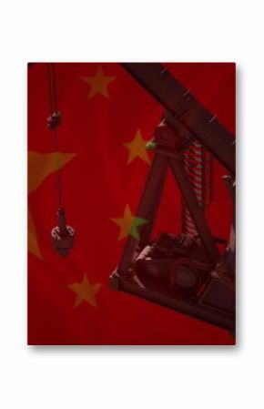 Image of pumping oil derrick over flag of china