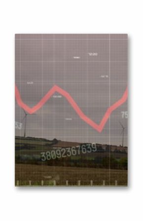 Image of financial data processing over wind turbines on field
