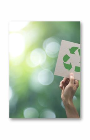 Hand holding recycle symbol on green bokeh background. eco and save the earth concept.