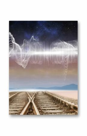 Train tracks under energy wave in desert